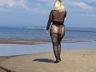 black style flashing on the beach in pantyhose