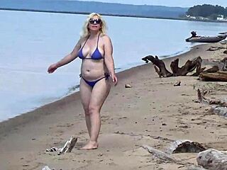 mature blondes walk on the beach in bikinis
