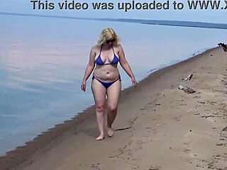 mature blondes walk on the beach in bikinis