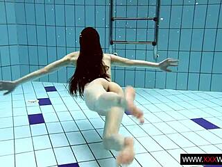 brunette with long hair underwater